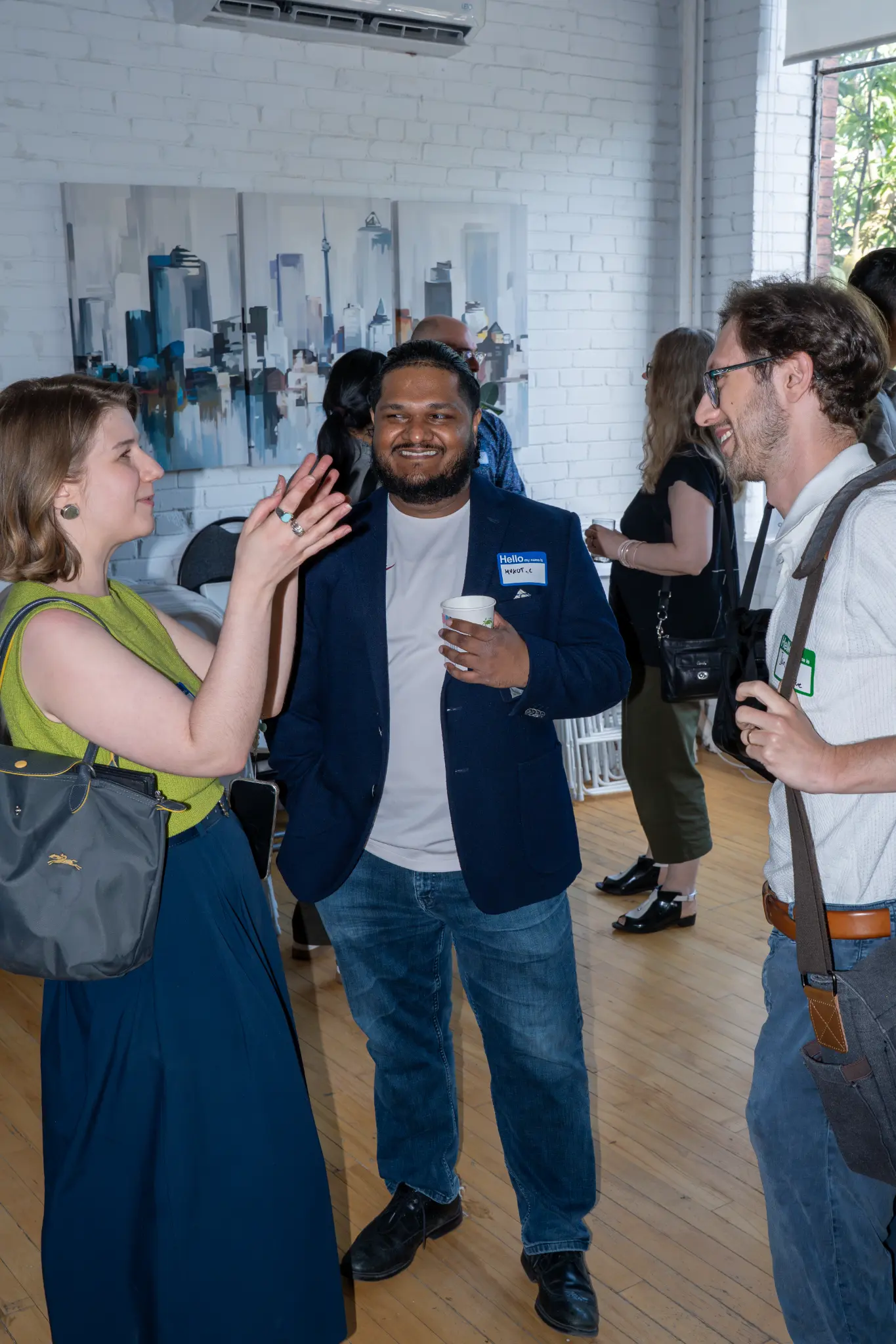 Guests connecting over drinks during a daytime networking gathering