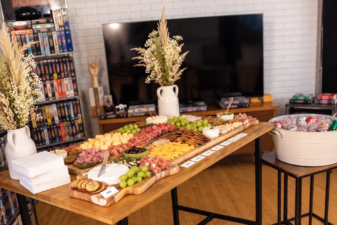 A charcuterie board and refreshments arranged for an intimate film-themed gathering